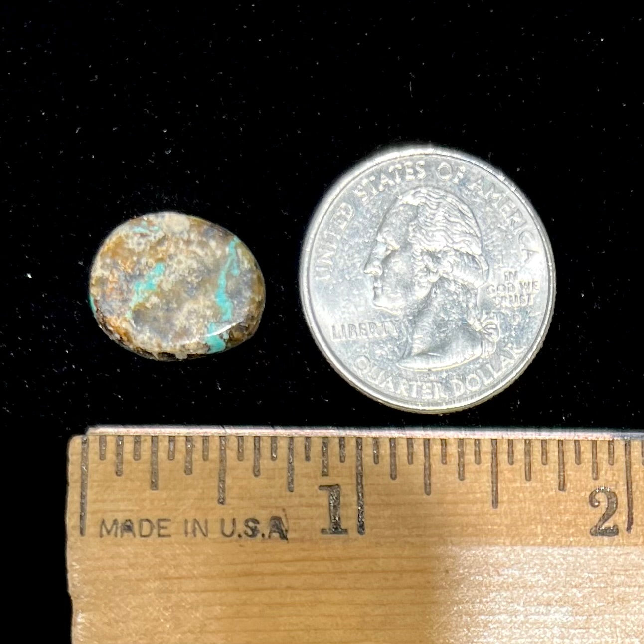 A loose, oval cabochon cut Morenci turquoise stone.