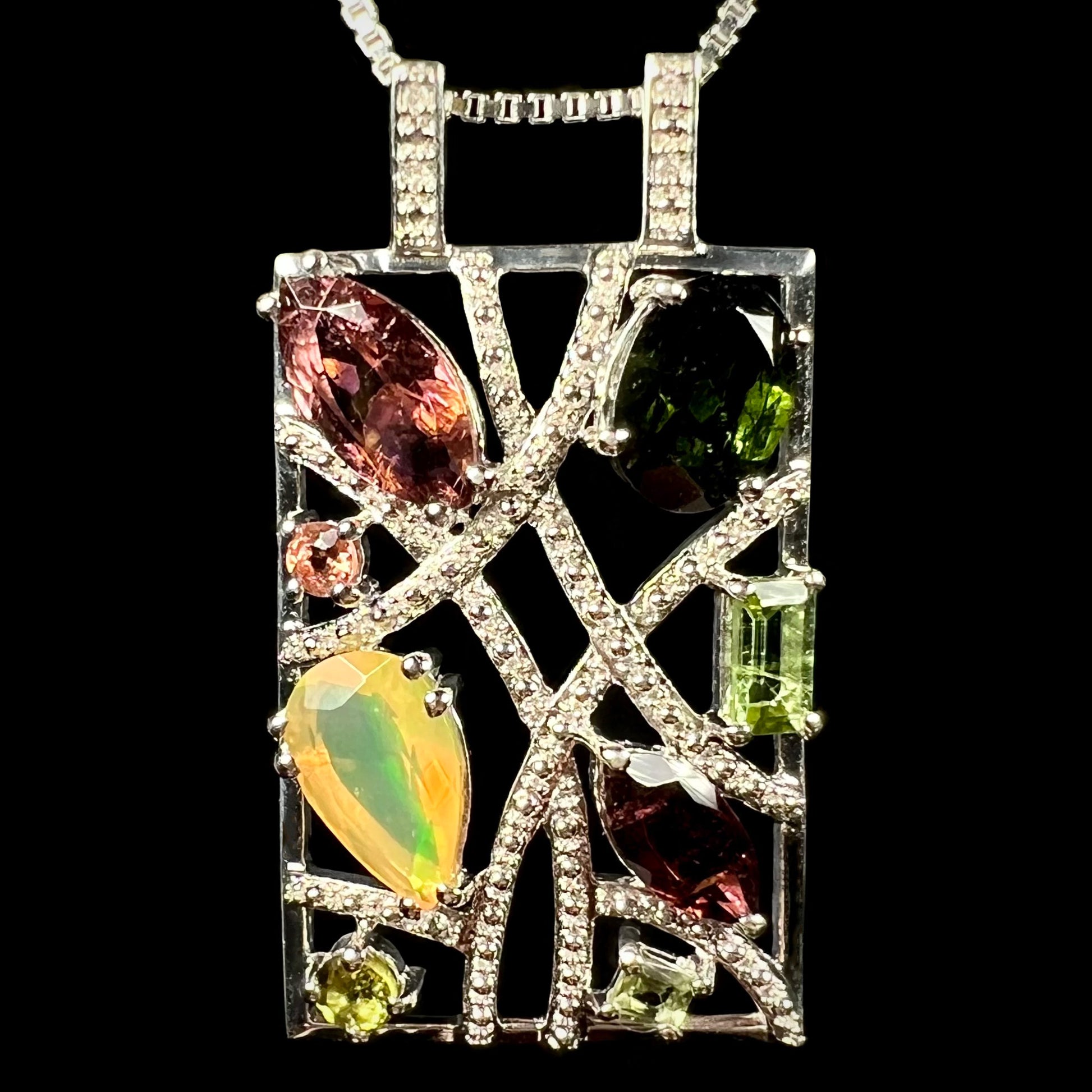 A sterling silver multi-gemstone necklace set with Ethiopian opal, tourmaline, and diamonds.
