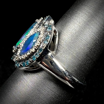 Side view of a sterling silver opal and blue diamond ring, focusing on the ring's shank.
