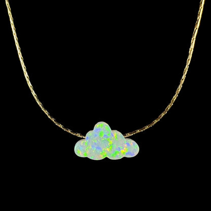 Lab-created opal cloud necklace shown from the front against black background.