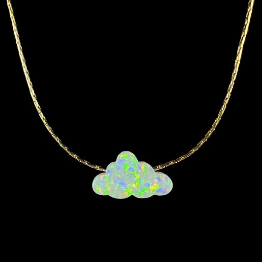 Lab-created opal cloud necklace shown from the front against black background.