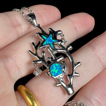 A silver plated coral reef necklace with blue lab-created opal inlay and CZ accents.