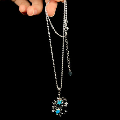 A silver plated coral reef necklace with blue lab-created opal inlay and CZ accents.