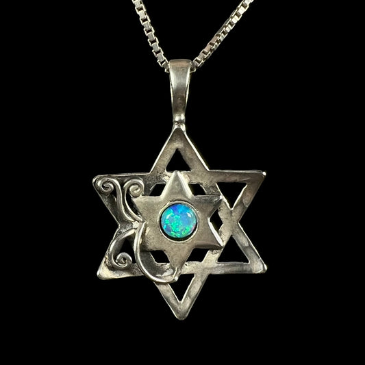 A sterling silver opal Star of David necklace shown from the front against a black background.