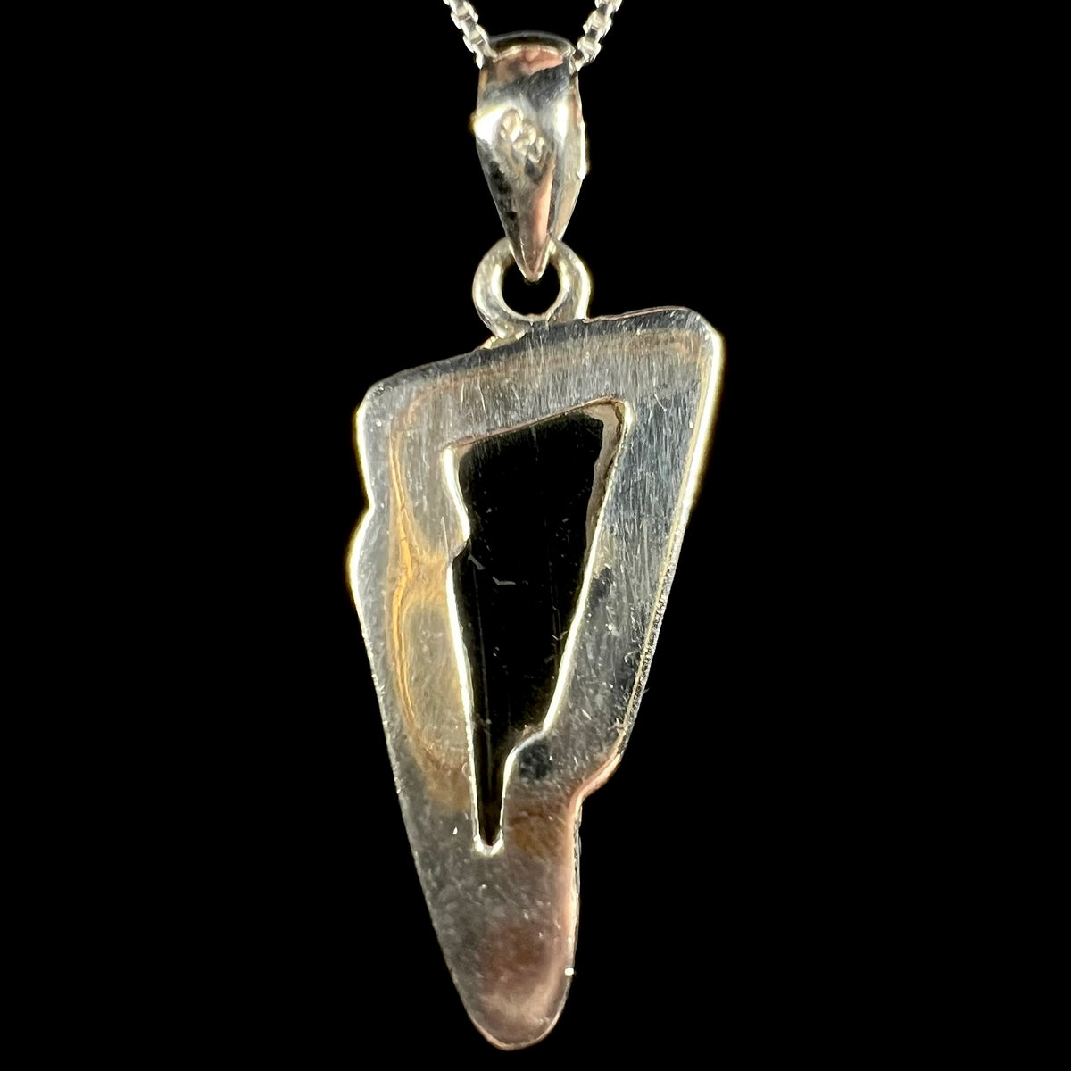 Back side of sterling silver opal mosaic triplet pendant with black glass backing, "925" hallmark stamp visible on bail.