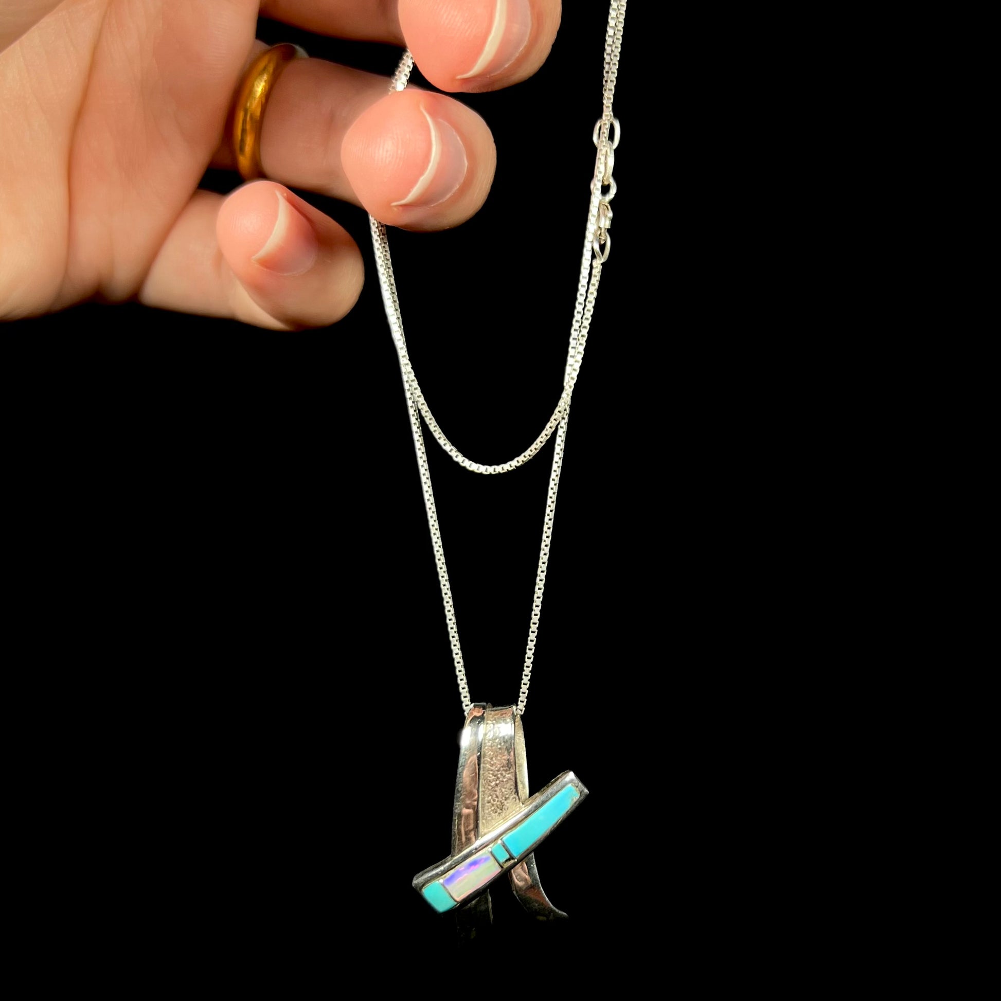 A folded design sterling silver turquoise and lab-created opal inlay necklace.