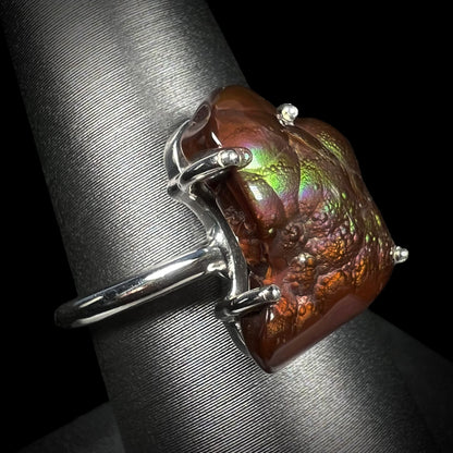 Opposite side of the Deer Creek fire agate ring showing green and subtle purple iridescence.