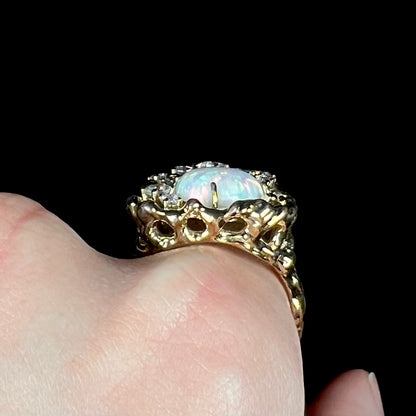 Gallery view of organic-style gold-tone lab-created opal and CZ men's ring, worn on a hand.
