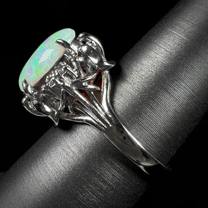 The side view of an ornate platinum opal ring made in Japan.