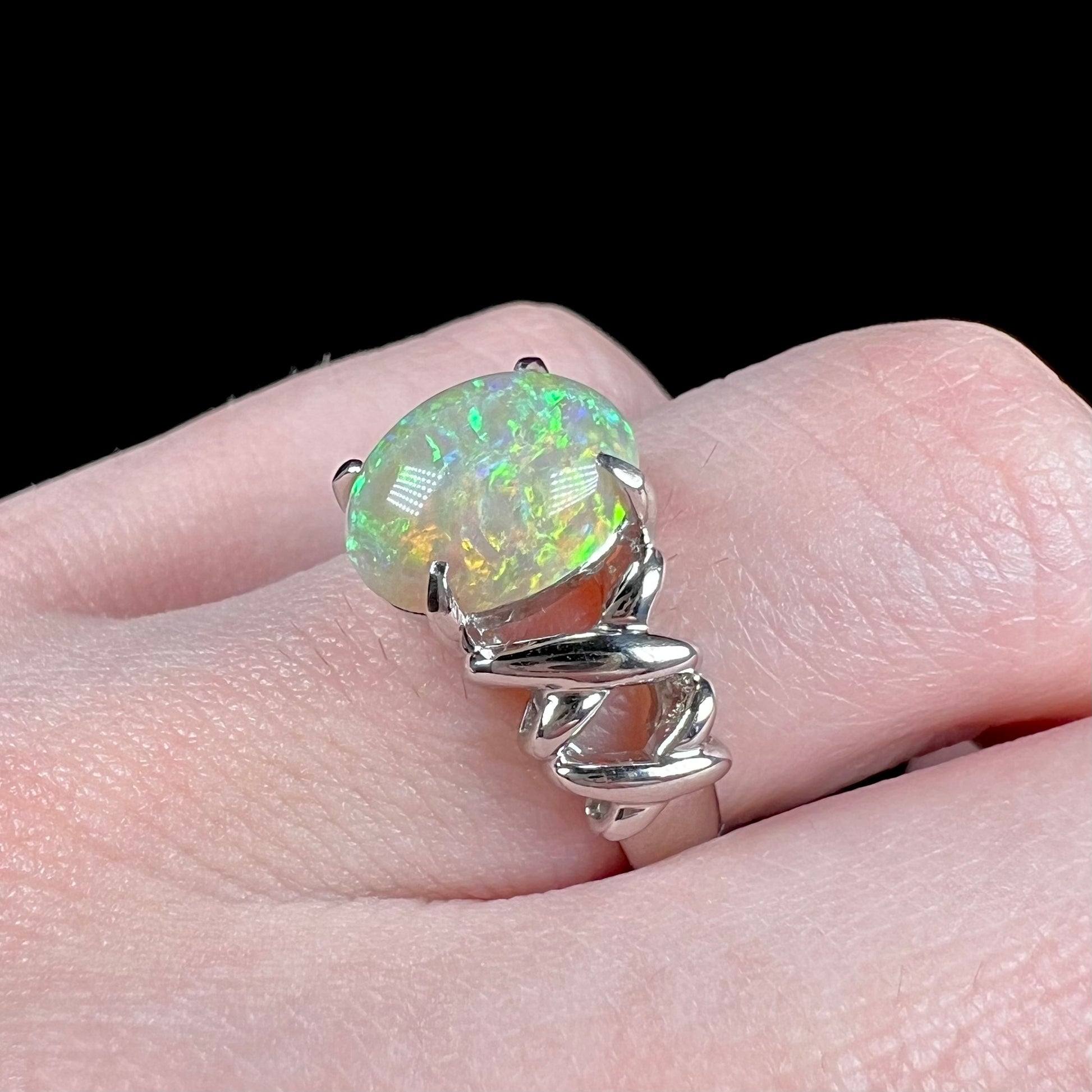 A platinum crisscross ring mounted with a Coober Pedy opal.