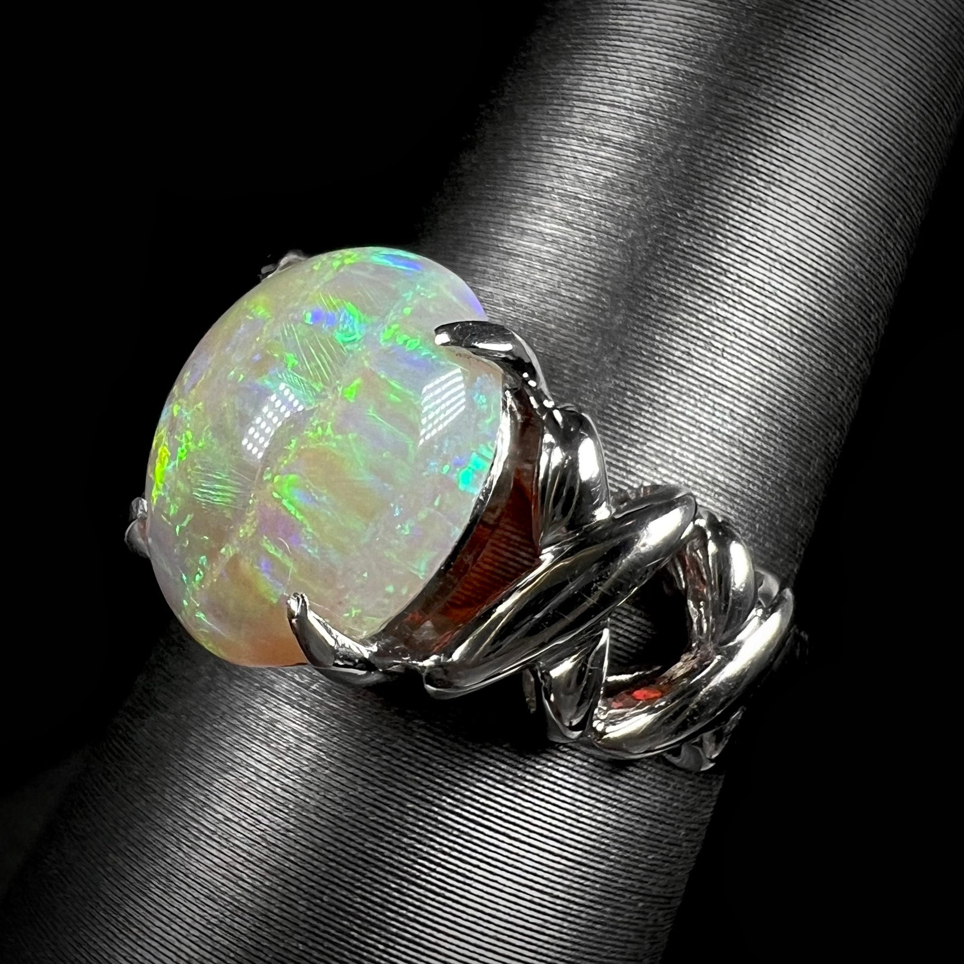 A platinum opal crisscross-design ring.