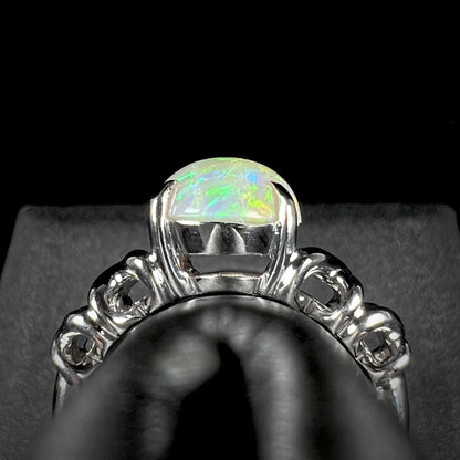 Gallery view of a platinum opal solitaire ring.