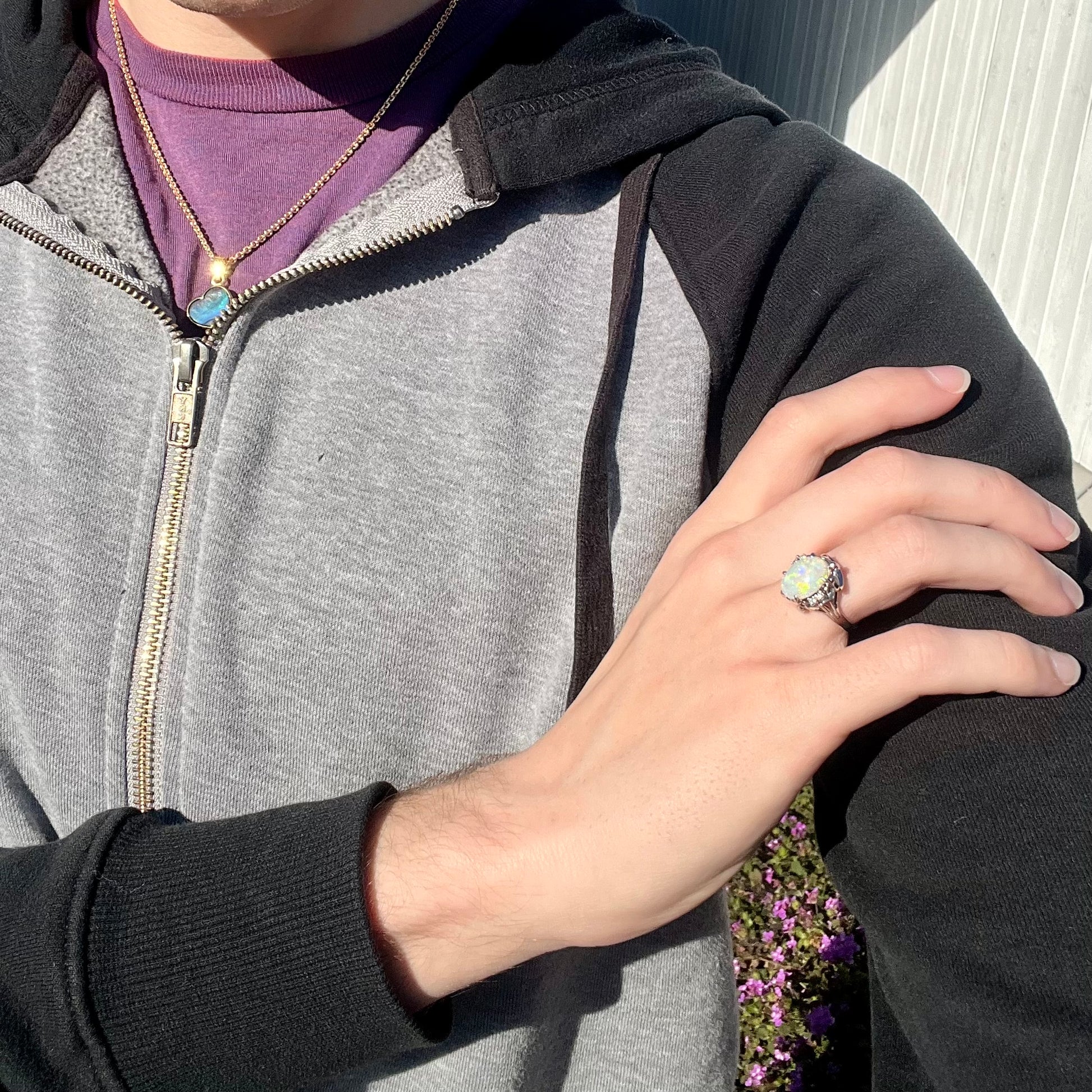 A Japanese-style platinum ring mounted with a Coober Pedy opal and diamond accents.