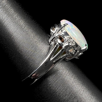 Side view of a platinum opal ring.  The ring has a Japanese design.