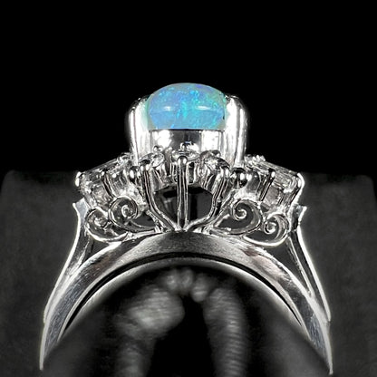 Macro gallery profile view showcasing open filigree under halo, with the opal showing blue color play.