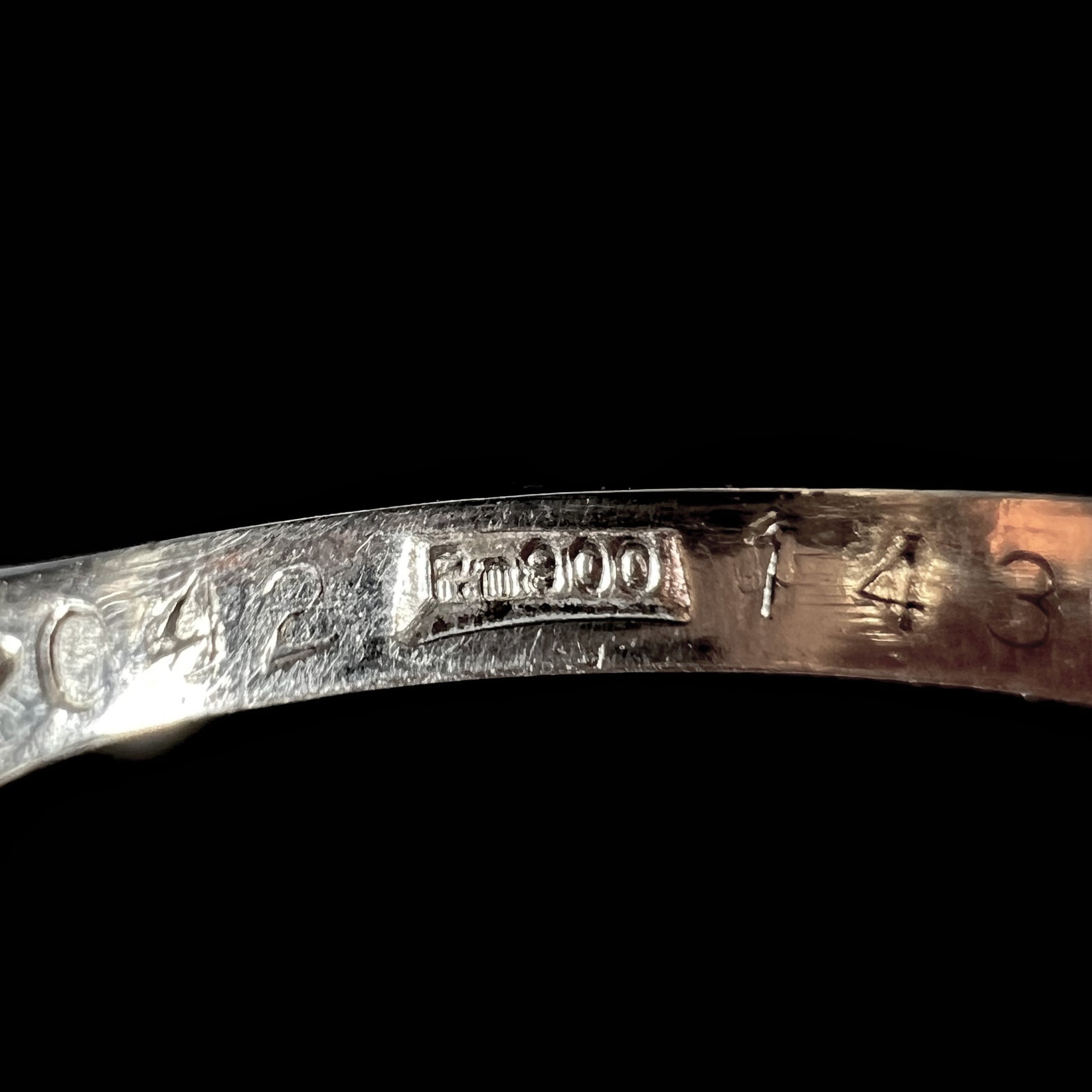 Inside of platinum ring shank showing 'PM900'pre-1960s Japan platinum ring stamp.