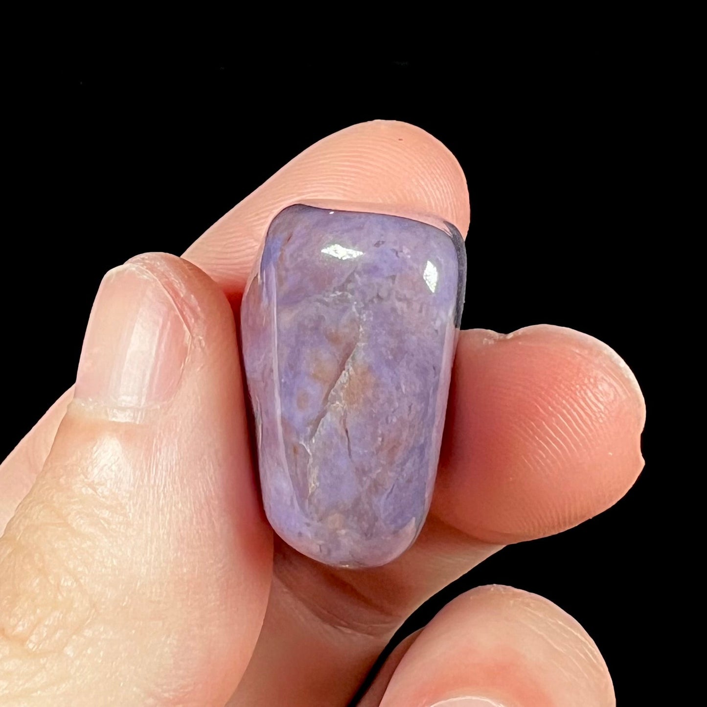 A tumble polished piece of purple turkiyenite jade stone.  Material from Bursa, Turkey.