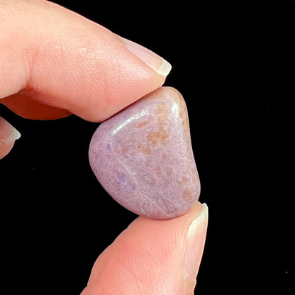 A tumble polished purple turkiyenite jade stone from Bursa, Turkey.