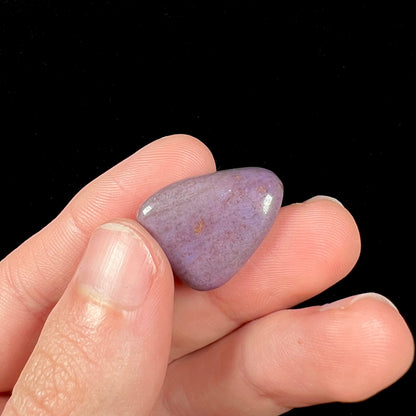 A tumbled purple turkiyenite jade stone from Borsa, Turkey.  The stone has a green jadeite inclusion.