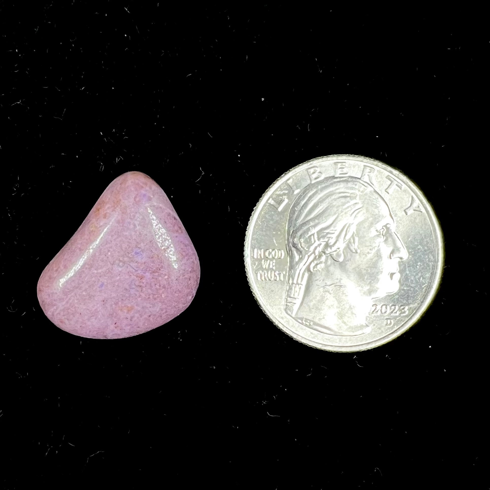 A tumble polished purple turkiyenite jade stone from Bursa, Turkey.