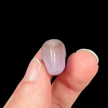 A tumble polished turkiyenite purple jade stone from Bursa, Turkey.