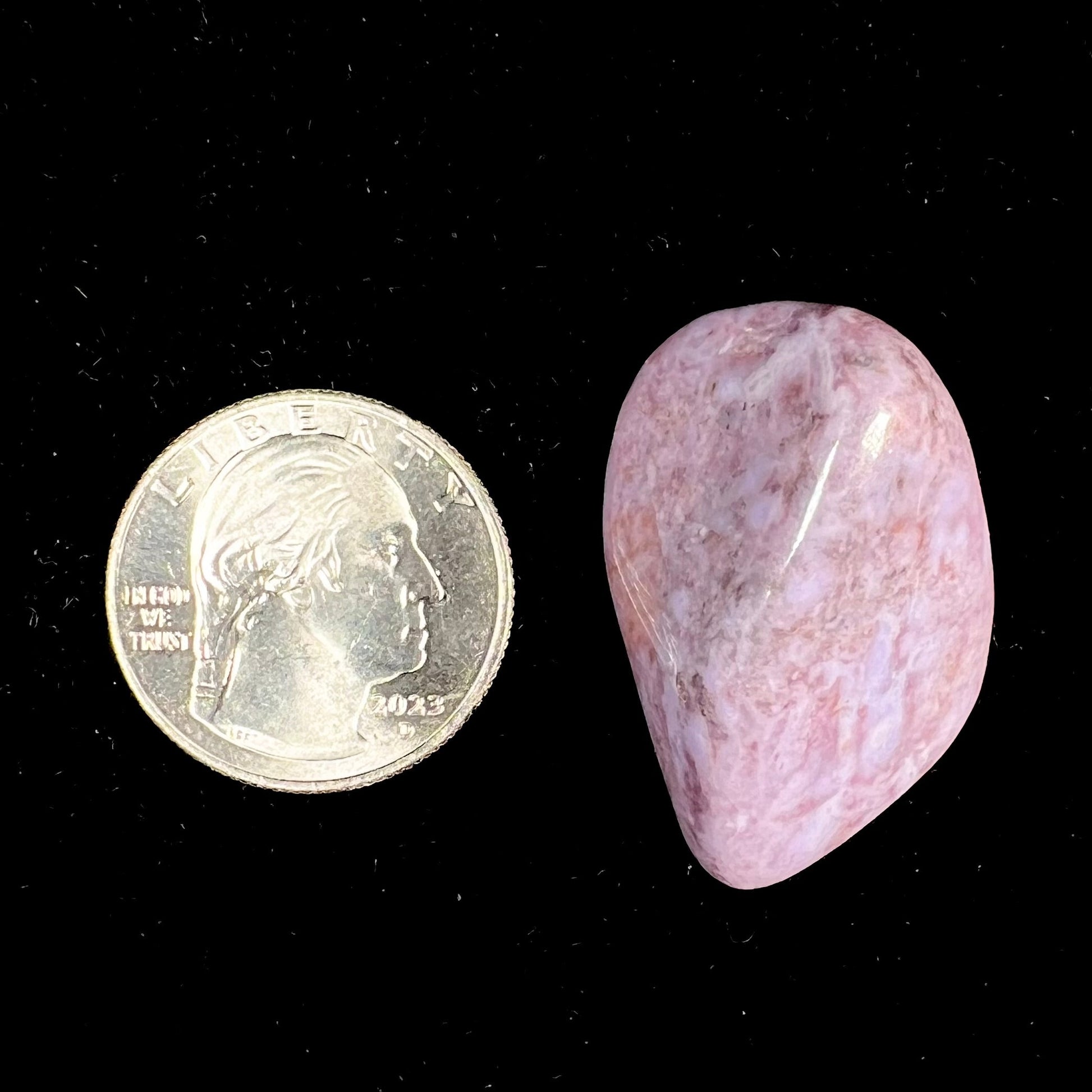 A tumbled purple turkiyenite jade stone from Bursa, Turkey.