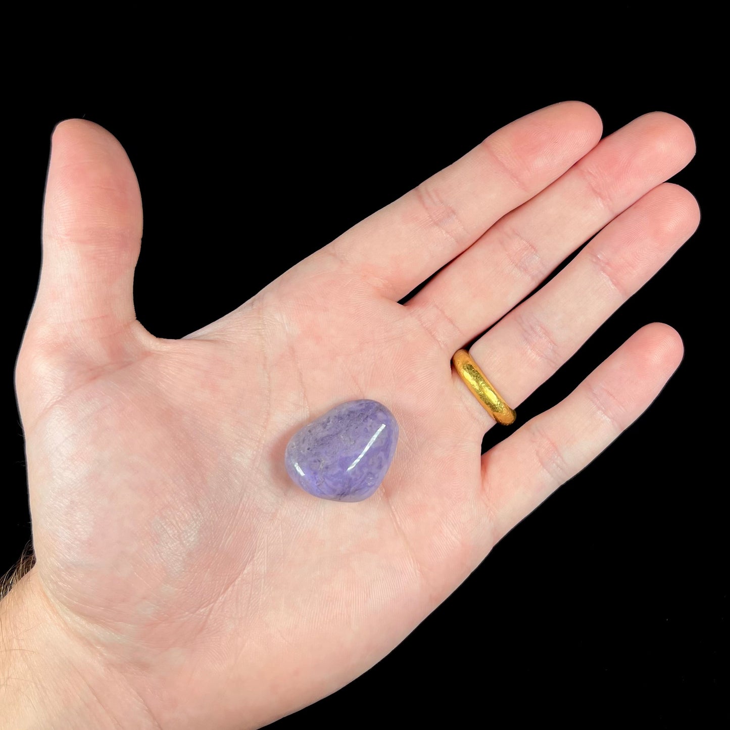 A rounded, tumbled piece of purple turkiyenite jade.  Bursa, Turkish material.