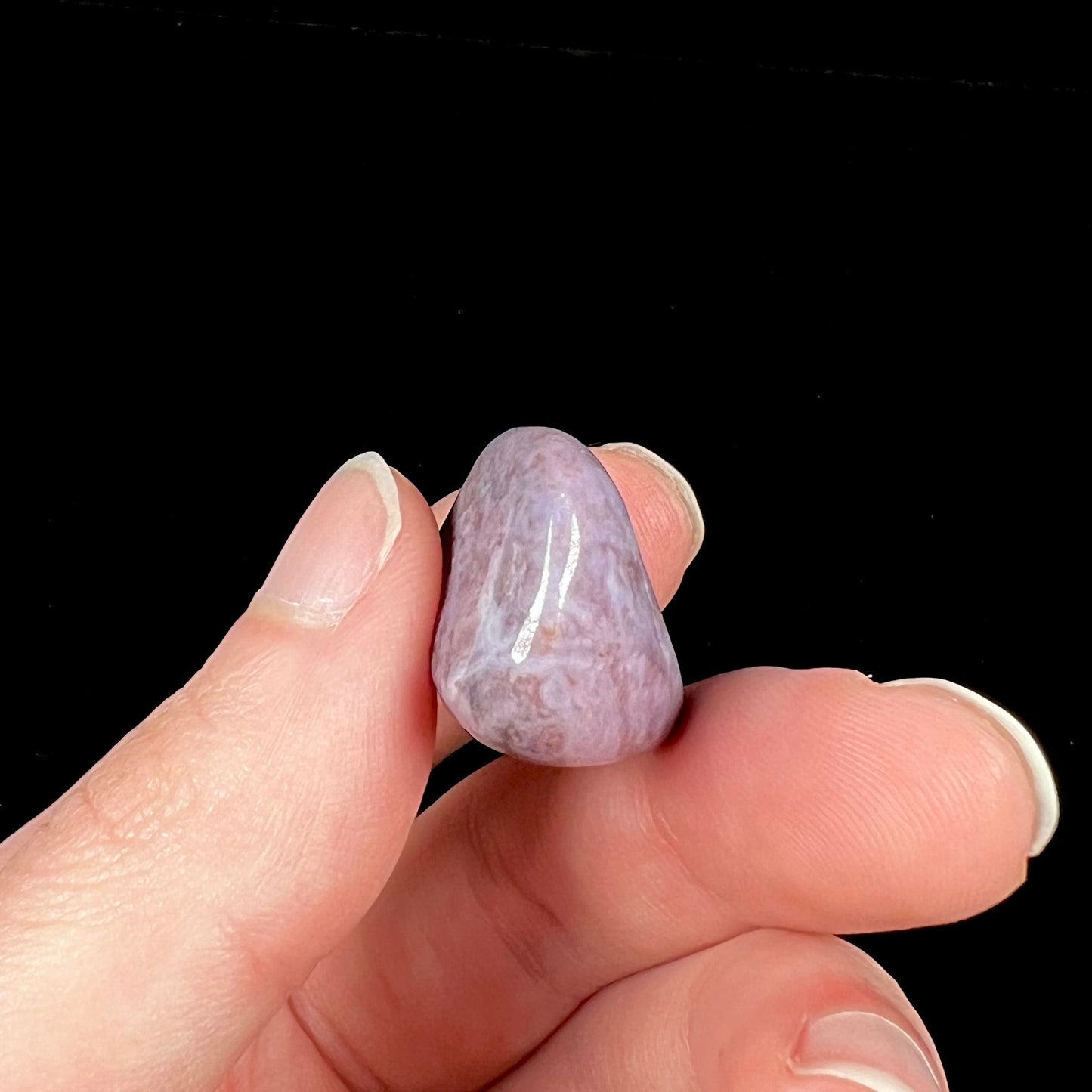 A tumbled purple turkiyenite jade stone from Bursa, Turkey.