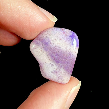 A streaked and spotted purple turkiyenite jade stone from Bursa, Turkey.