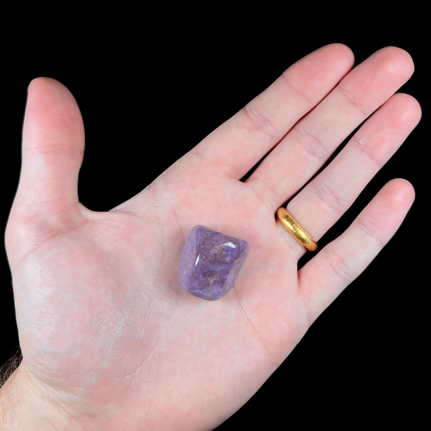 A tumble polished piece of purple turkiyenite jade stone.  Material from Bursa, Turkey.