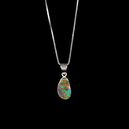 A sterling silver pendant set with an Australian boulder opal on a silver box chain.
