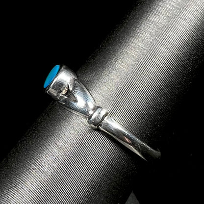 Side view of refurbished sterling silver opal doublet ring on display showing split shank design