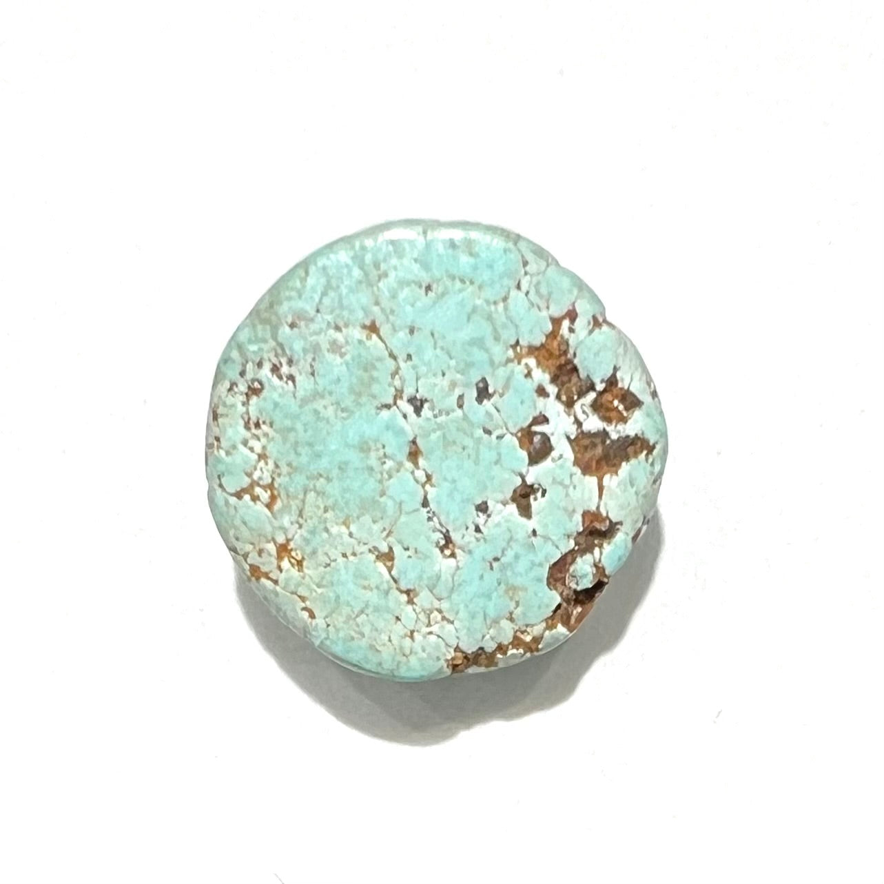 A round cabochon cut Sleeping Beauty turquoise stone from Arizona.