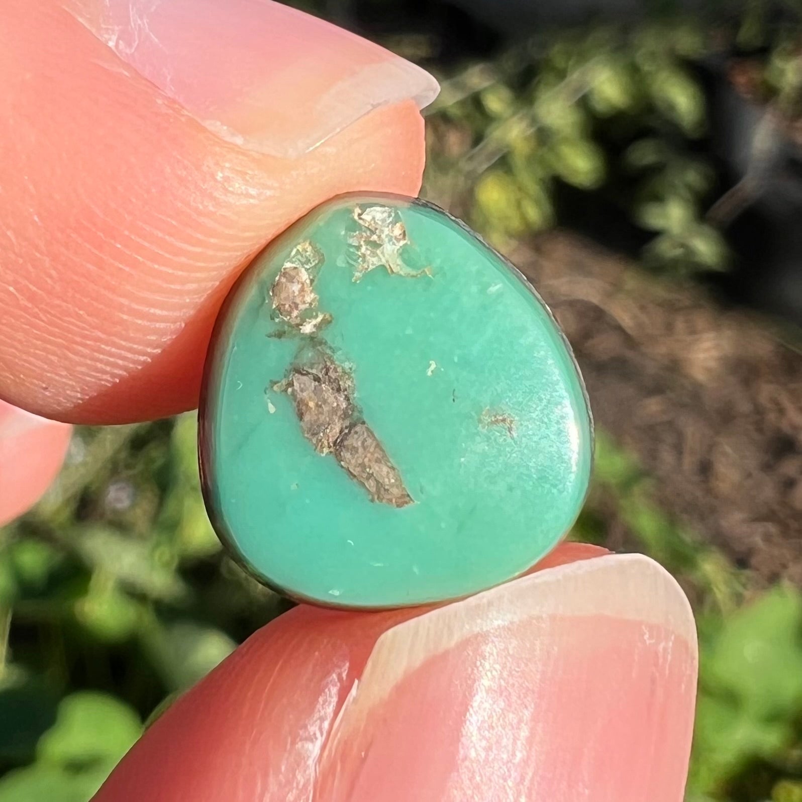 A pear shaped green turquoise stone from Royston Mining District in Nevada.