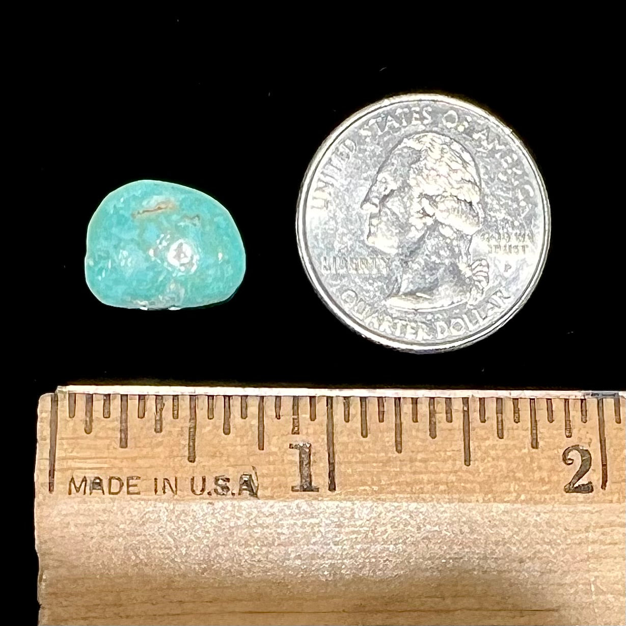 A backed, light bluish green Royston turquoise stone from Nevada.