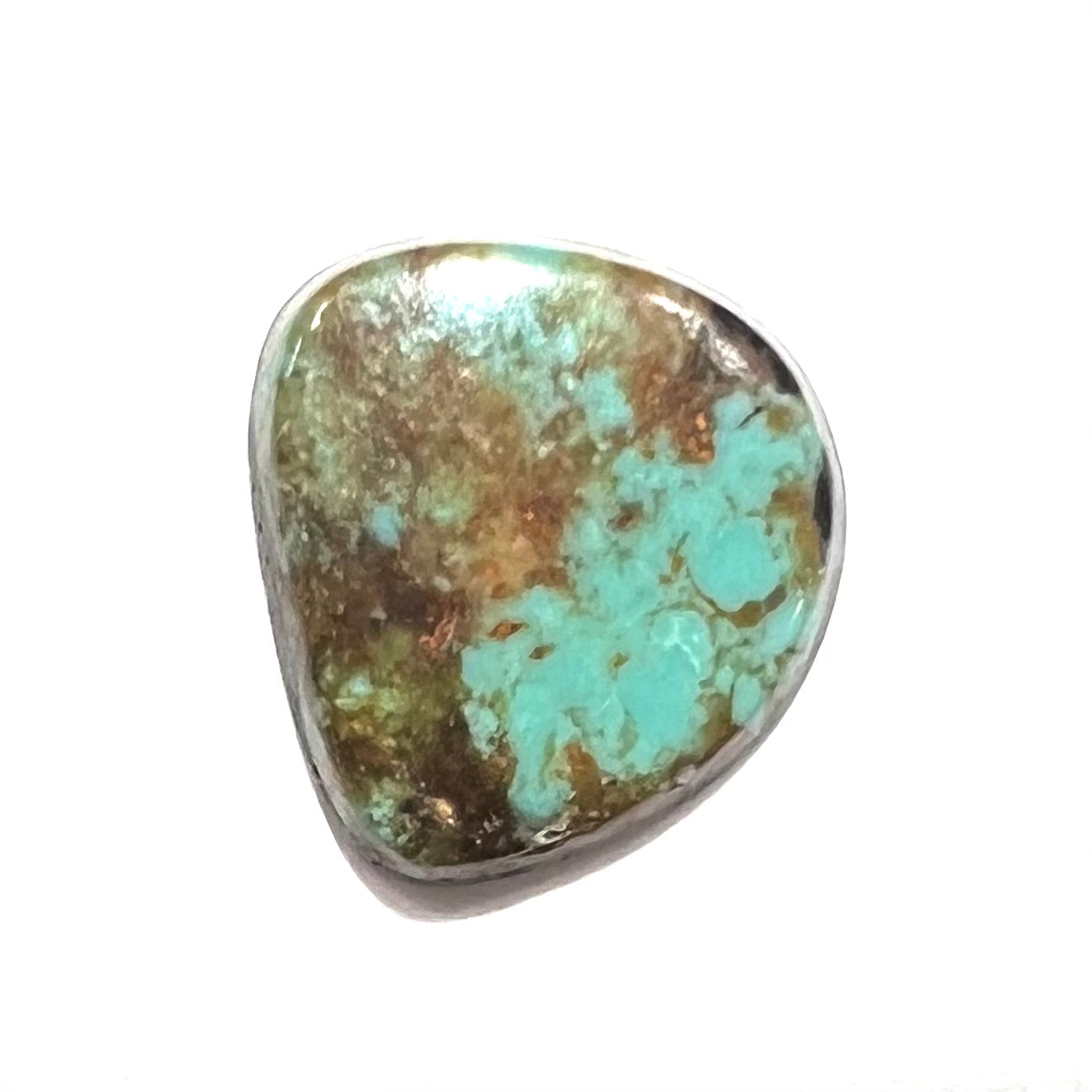 A loose, freeform cabochon cut Royston turquoise stone.