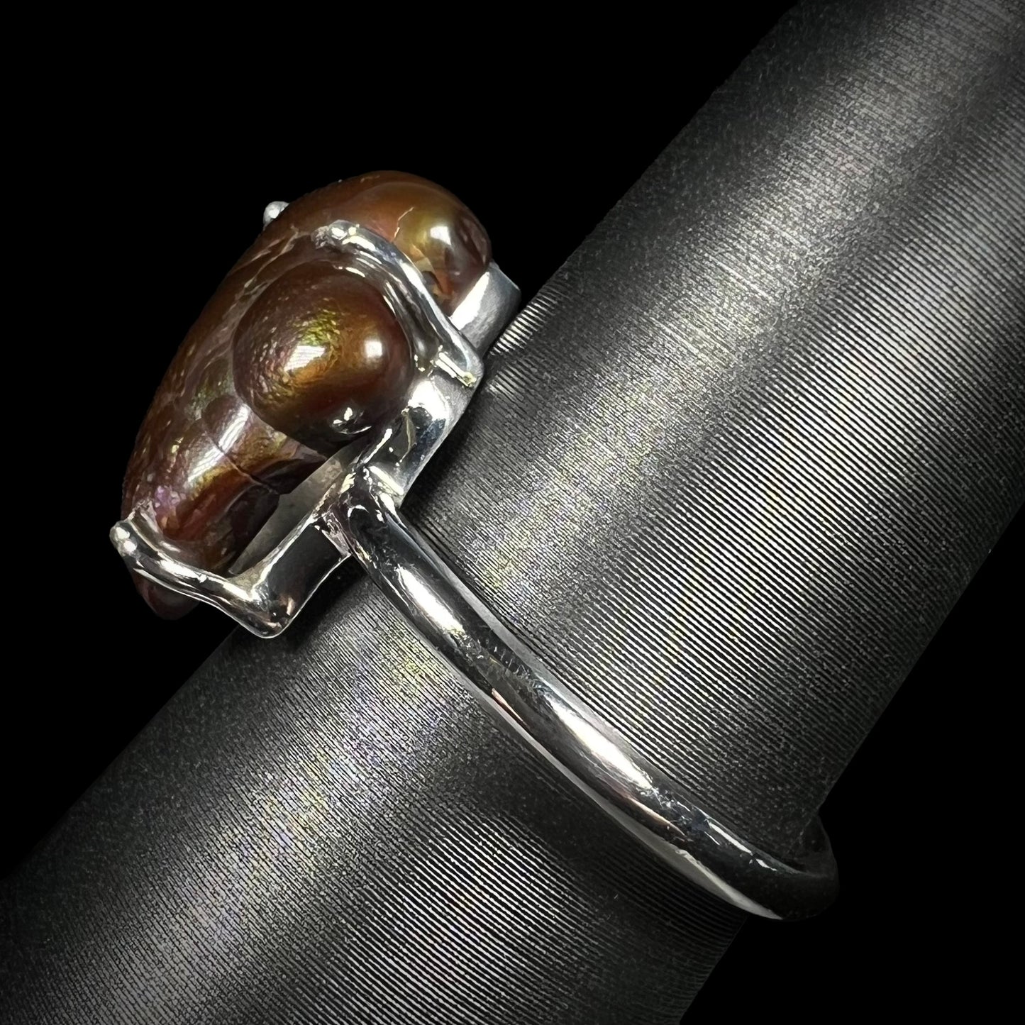Side profile of the Deer Creek fire agate ring with brown color dominant in the stone.