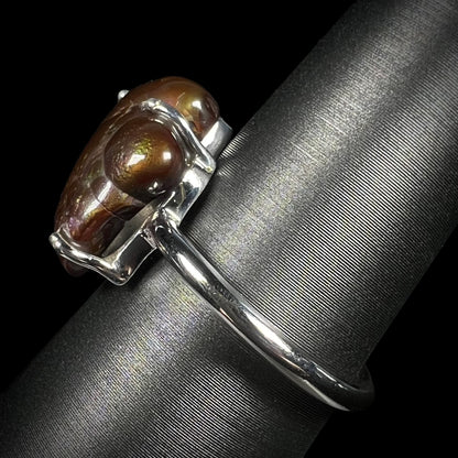 Side profile of the Deer Creek fire agate ring with brown color dominant in the stone.