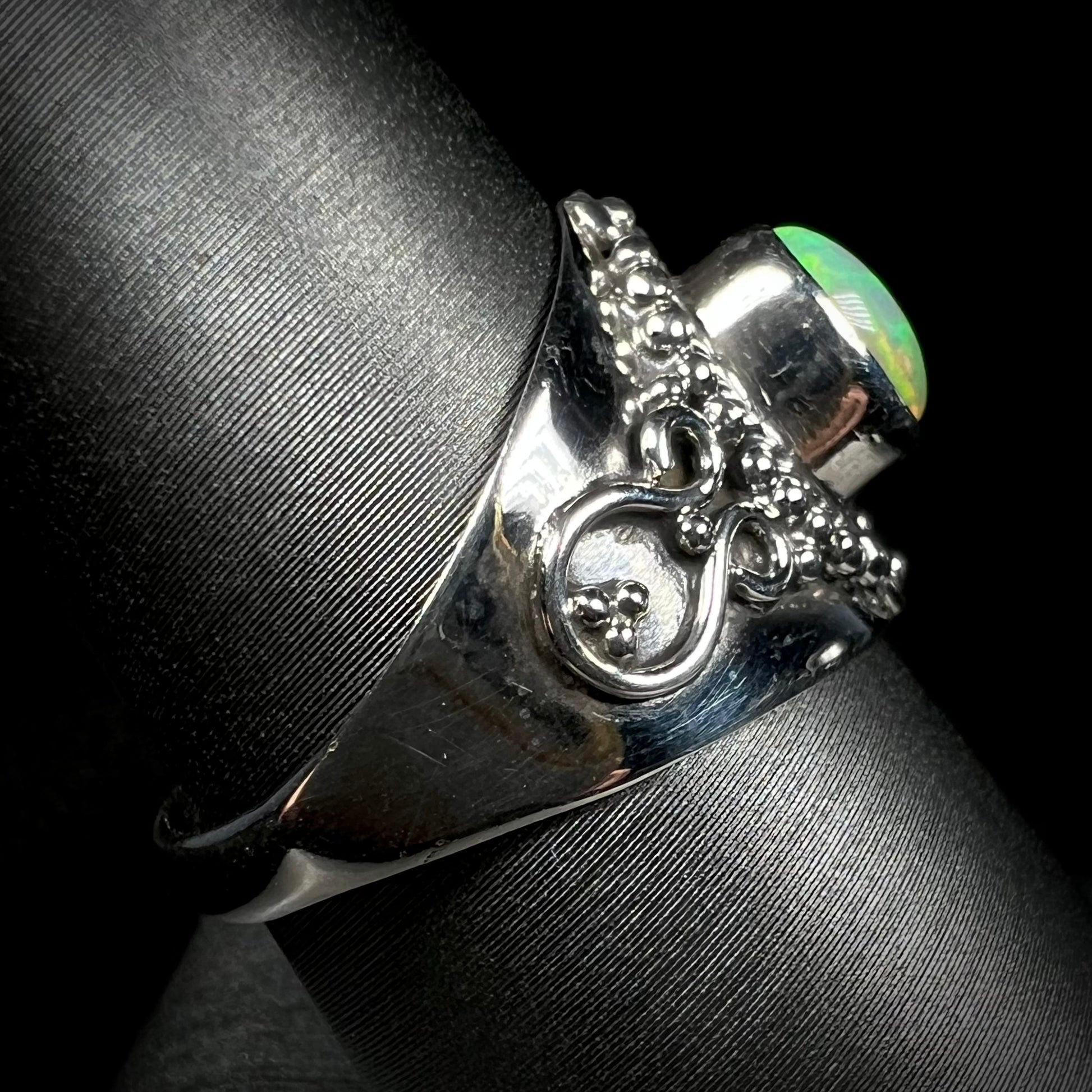 Side view of a silver Boho-style ring mounted with an Ethiopian fire opal.