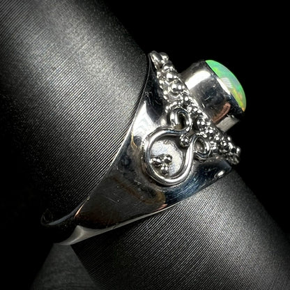 Side view of a silver Boho-style ring mounted with an Ethiopian fire opal.