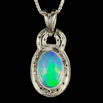 Back side of sterling silver Ethiopian opal pendant showing "925" hallmark stamp and back of opal