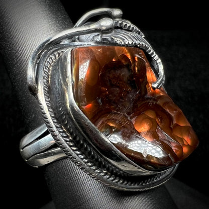 Angled view of a men's silver, Southwest-style fire agate ring.