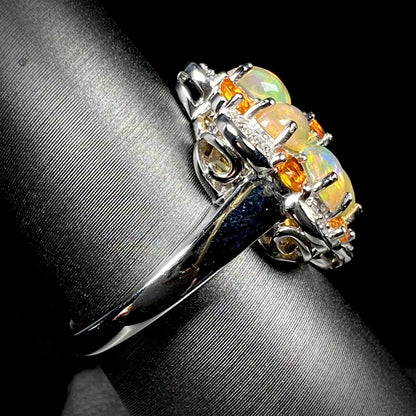 Side view of a sterling silver opal cluster ring, focused on the ring's shank.