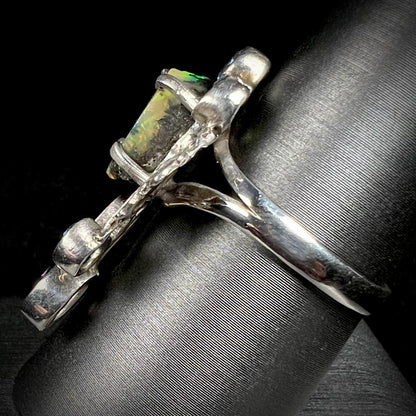 Side view of a men's handmade silver ring set with a rough opal from Virgin Valley, Nevada.