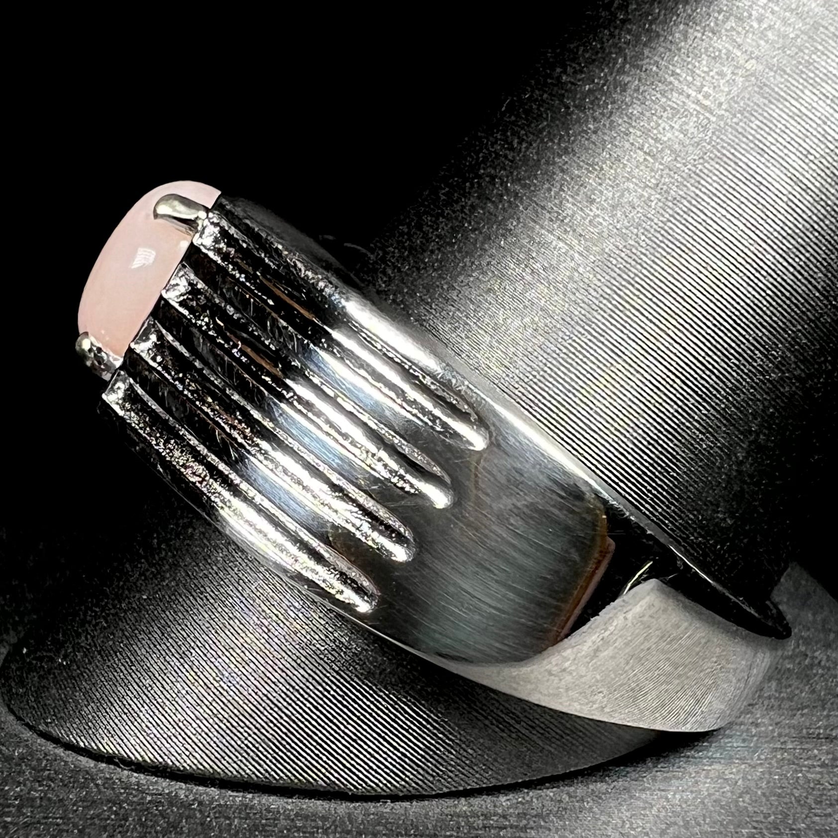 Side view of sterling silver pink opal ring on ring display
