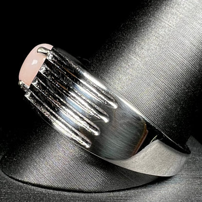 Side view of sterling silver pink opal ring on ring display