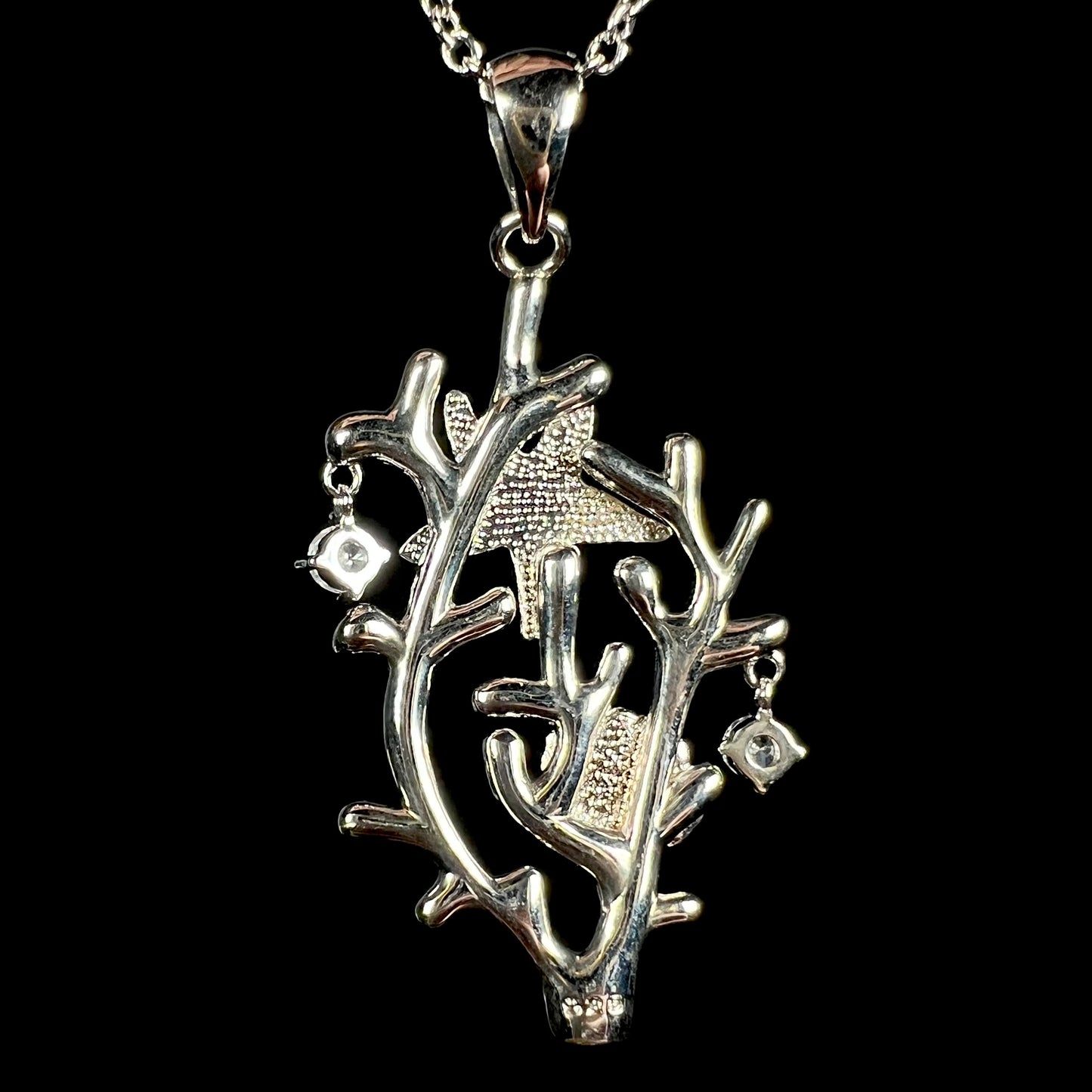 Back of a silver plated coral reef pendant stamped "925".