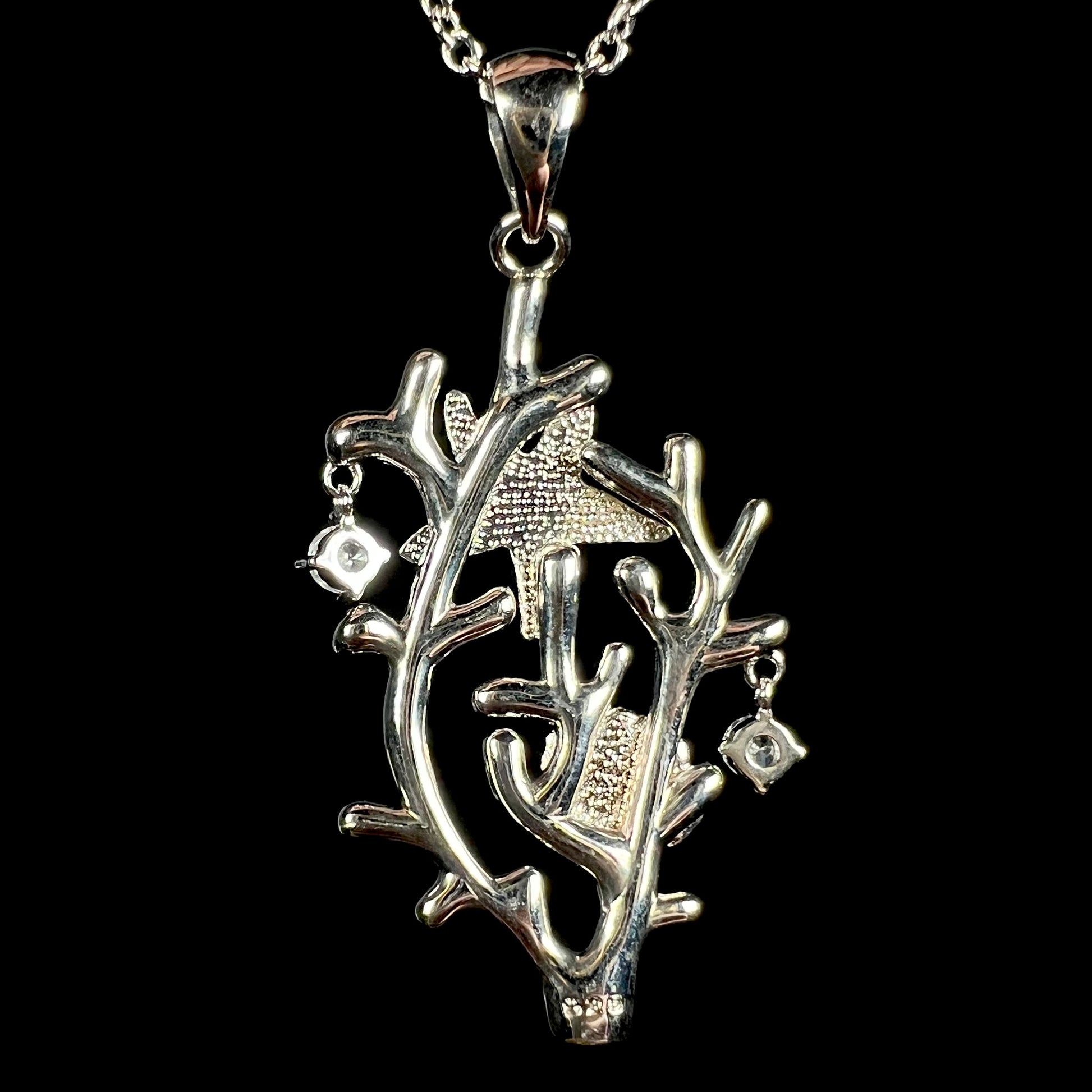 Back of a silver plated coral reef pendant stamped "925".