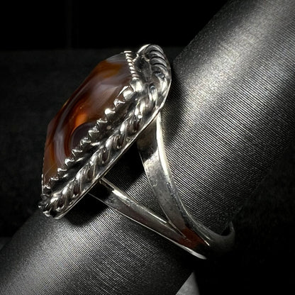 Side view of a sterling silver split shank on a fire agate ring.