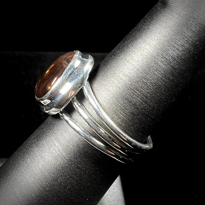 A ladies' fire agate ring set in a split-shank sterling silver mounting.